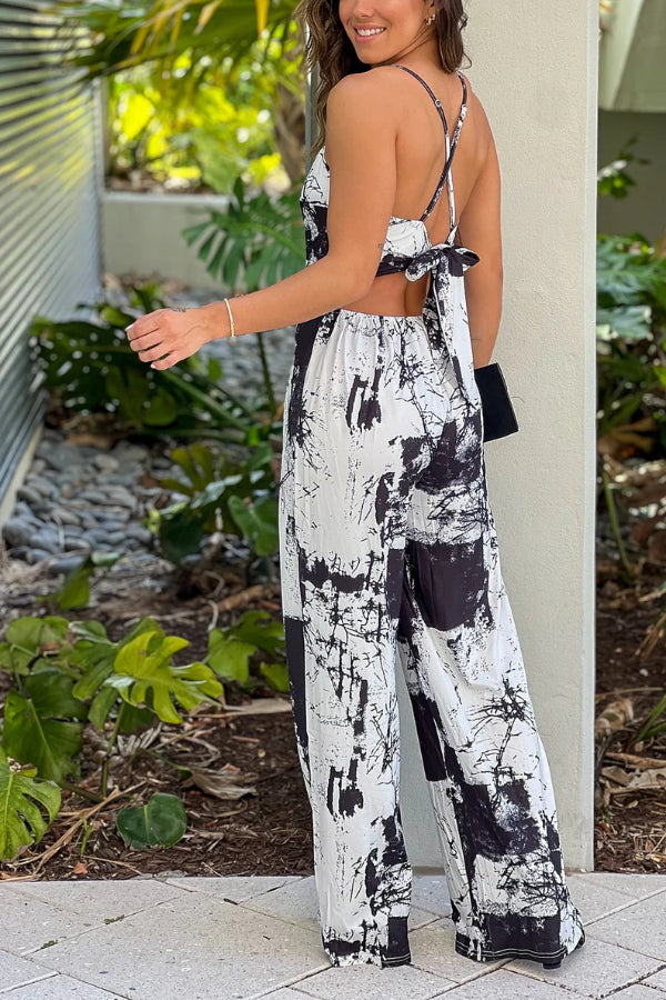 BLACK AND WHITE PRINTED JUMPSUIT WITH CRISS CROSS BACK