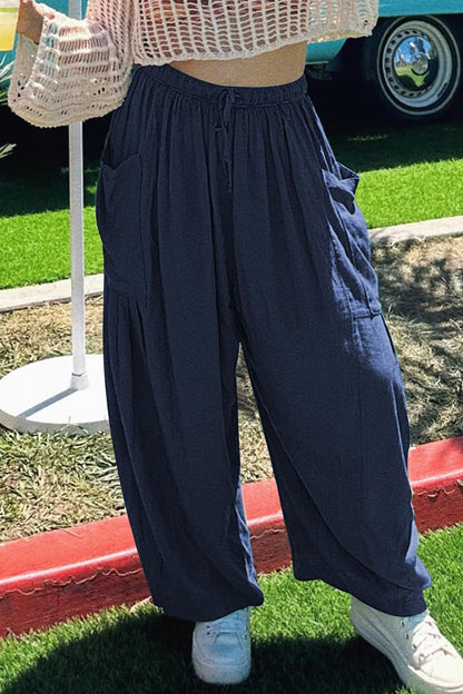 Pantalones casuales sencillos de color liso con bolsillos, holgados, de cintura media y pierna ancha.