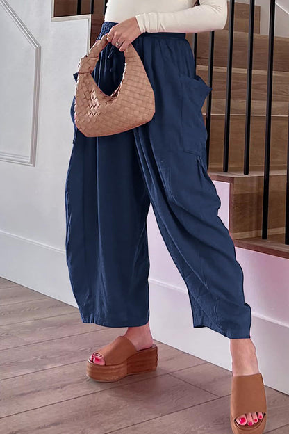 Pantalones casuales sencillos de color liso con bolsillos, holgados, de cintura media y pierna ancha.