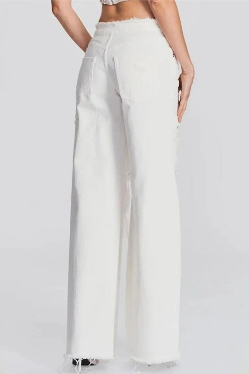 Vaqueros casuales de talle medio, rasgados, lisos y con parches (sujeto al modelo real)