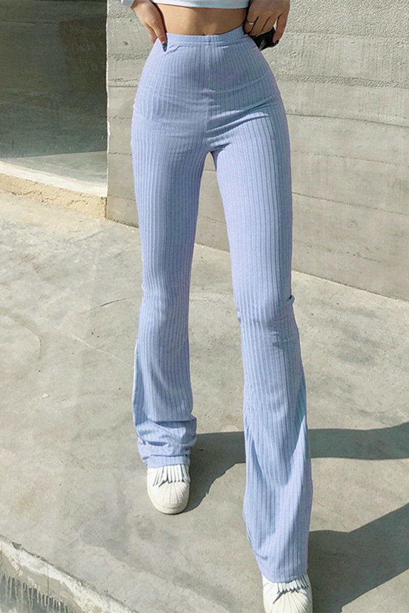 Pantalones casuales sencillos de color liso con cintura alta y botones.