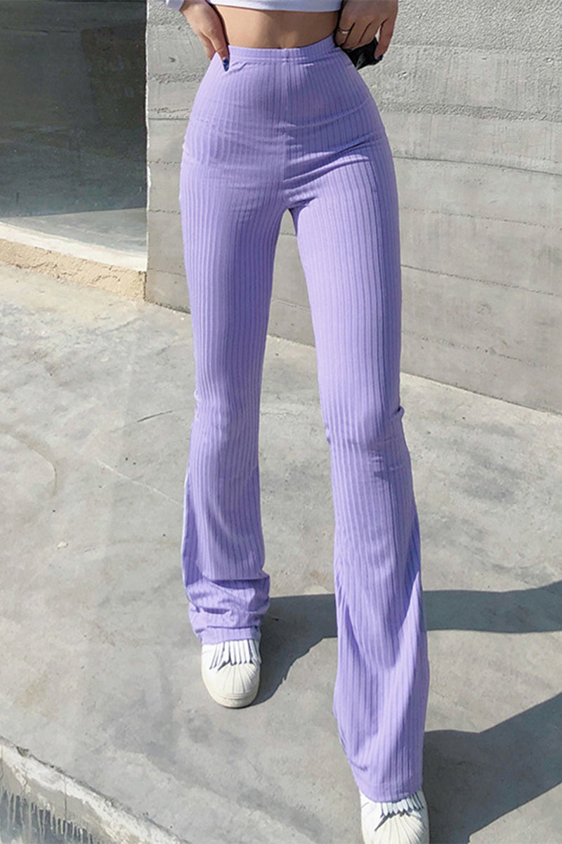 Pantalones casuales sencillos de color liso con cintura alta y botones.