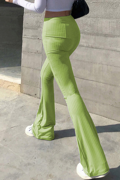 Pantalones casuales sencillos de color liso con cintura alta y botones.