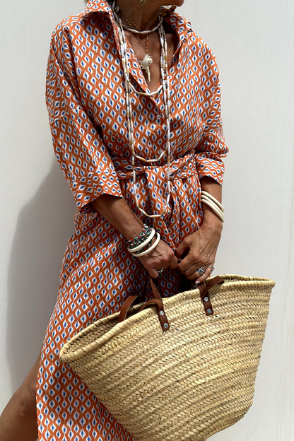 Vestidos camiseros informales con cuello vuelto, botones y cordones con estampado geométrico