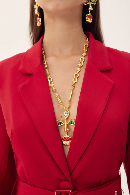 Collar retro con cara de mal de ojo 