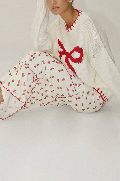 Suéter de punto con lazos rojos de Rosalia 