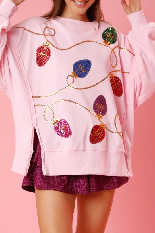 Sudadera con abertura y lentejuelas y luces navideñas