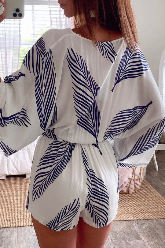 Mono blanco con estampado de plantas