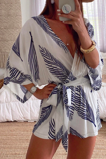 Mono blanco con estampado de plantas