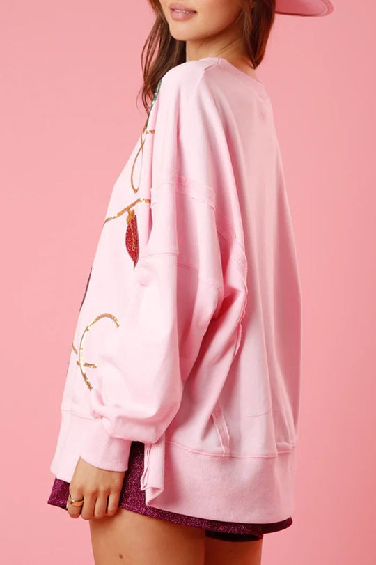 Sudadera con abertura y lentejuelas y luces navideñas