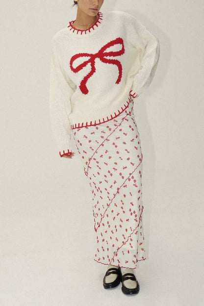 Suéter de punto con lazos rojos de Rosalia 