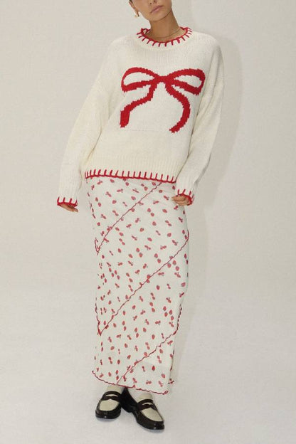 Suéter de punto con lazos rojos de Rosalia 