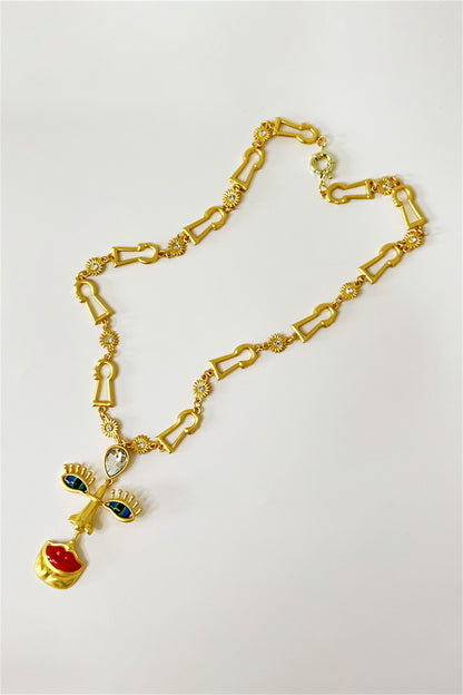 Collar retro con cara de mal de ojo 