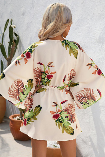 Mono amarillo de una pieza con estampado de plantas y cordones