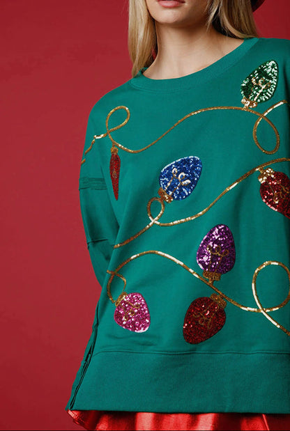Sudadera con abertura y lentejuelas y luces navideñas