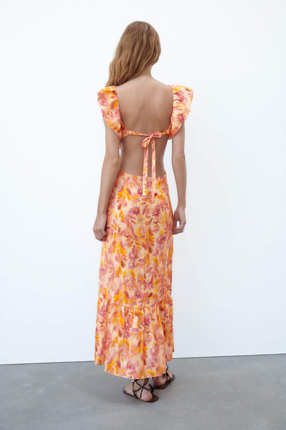 Vestido midi con volantes en el bajo y tirantes cruzados con estampado abstracto 